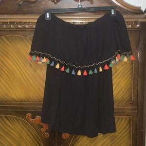 So cute. Ladies tasseled top can be worn off shoulders or on.
